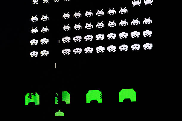 Borgosesia, Italy - September 1, 2012: Close up of vintage classic videogame on computer monitor: Space Invaders